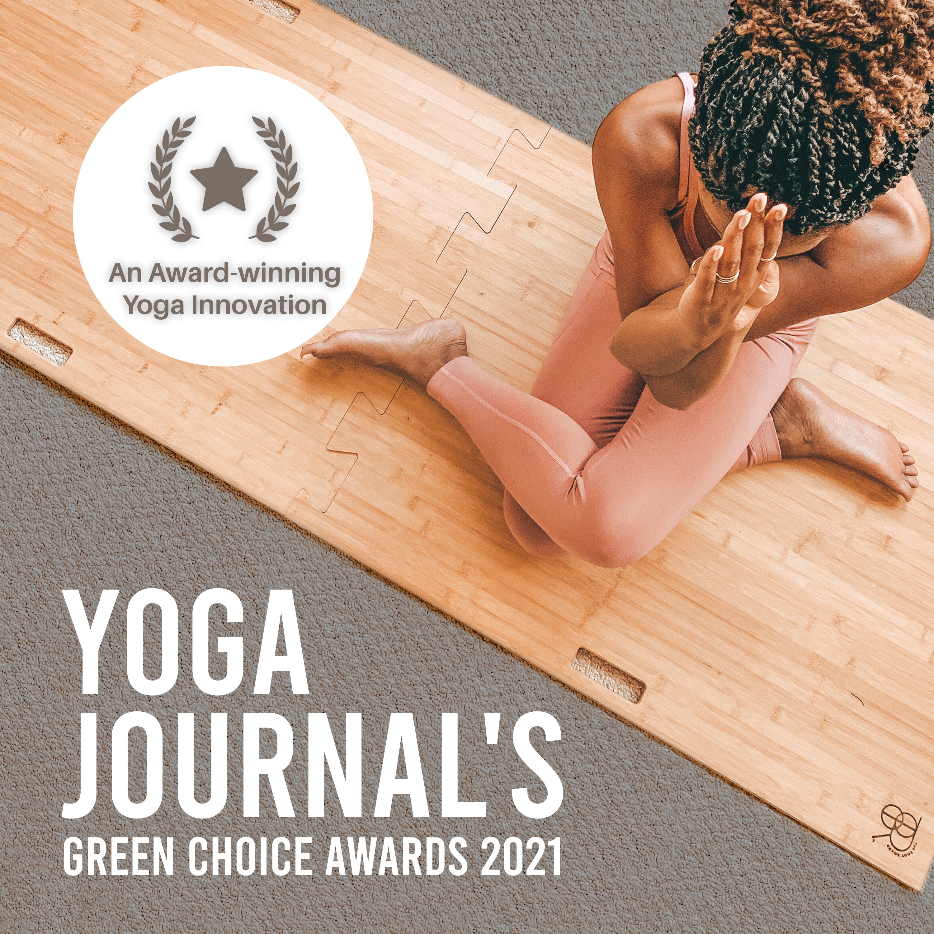yoga journal green choice award winner image of woman on bamboo root board