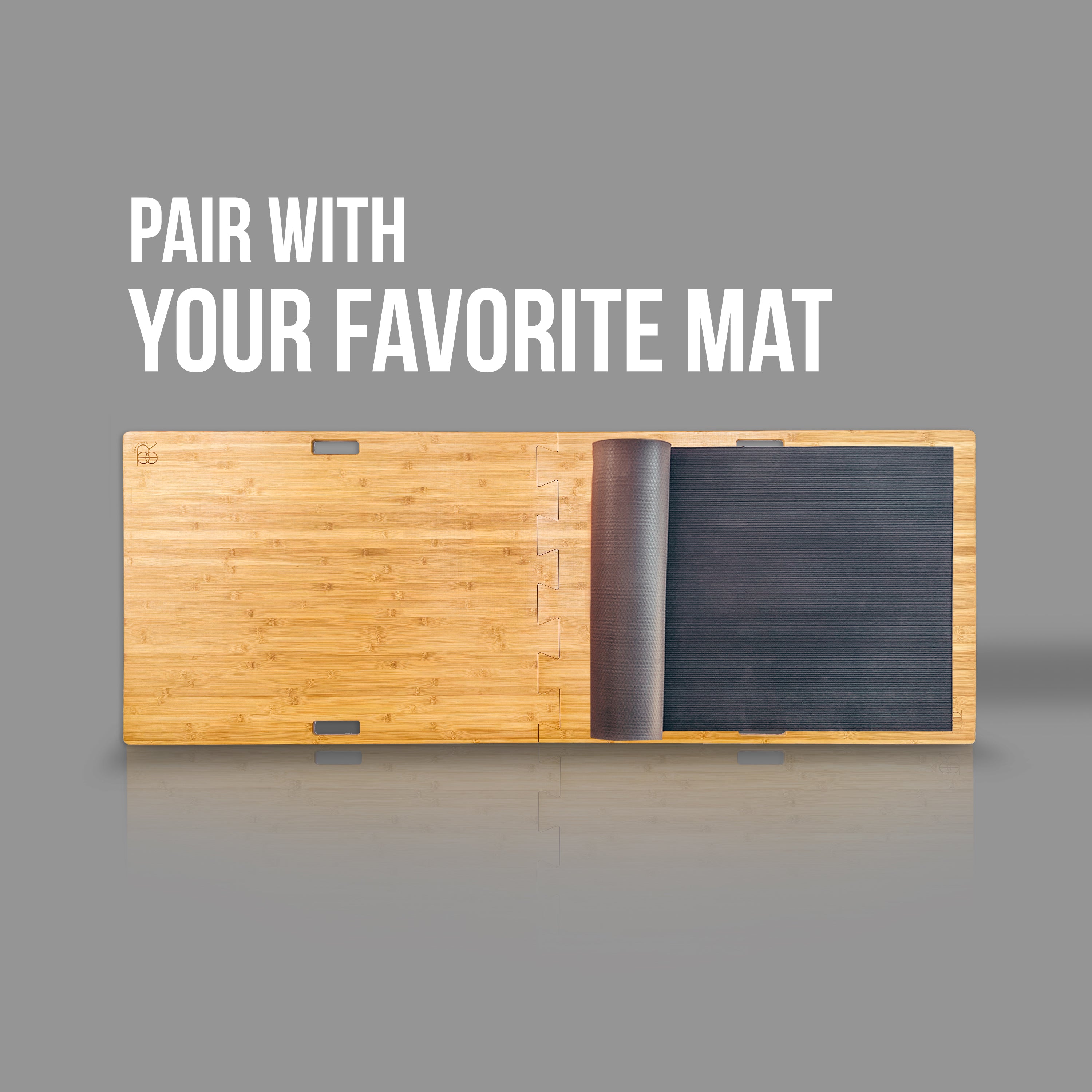 root board paired with a half rolled up black yoga mat
